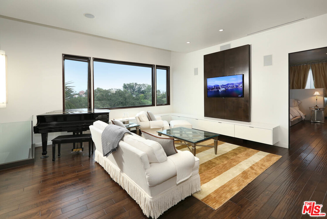 8532 Ridpath Drive Los Angeles, CA 90046 - Photo 14 of 52 a living room with furniture and a flat screen tv