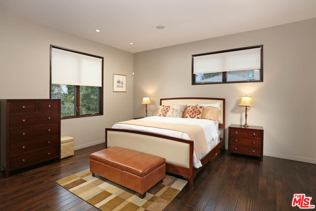 8532 Ridpath Drive Los Angeles, CA 90046 - Photo 17 of 52 a bedroom with a bed window and a dresser