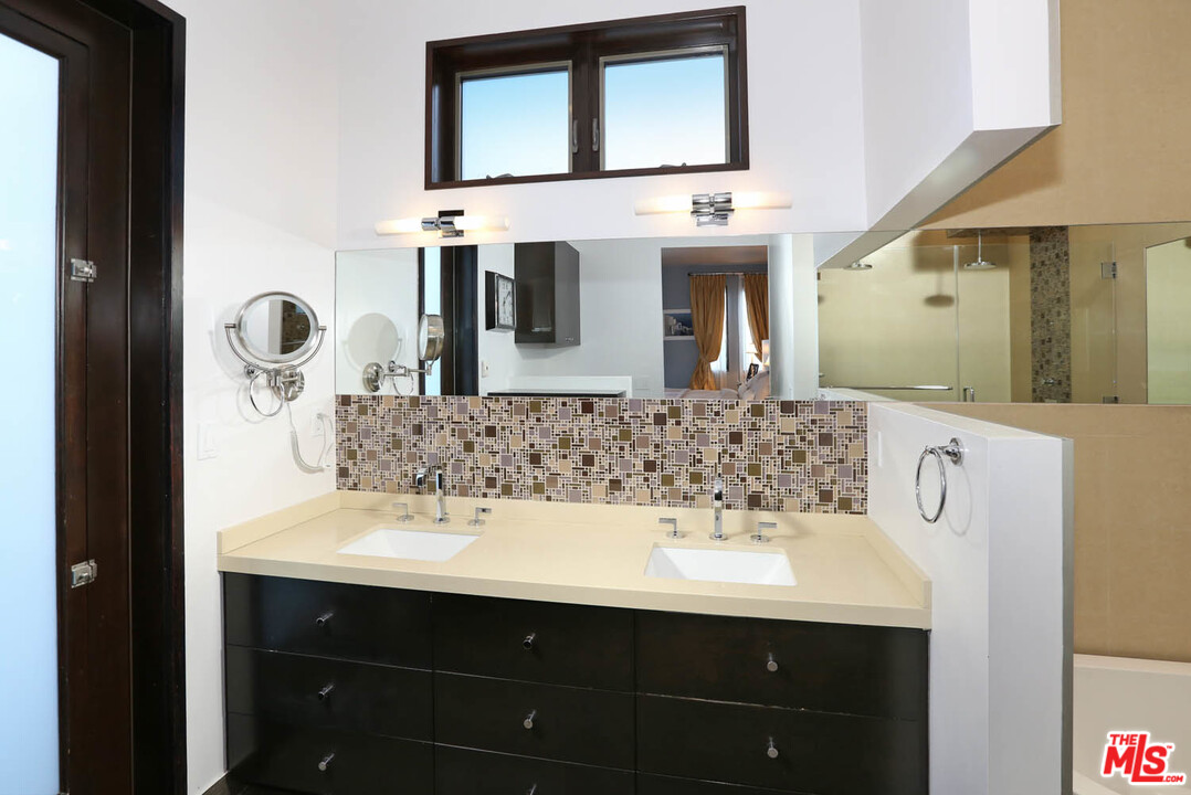 8532 Ridpath Drive Los Angeles, CA 90046 - Photo 18 of 52 a bathroom with a sink and a mirror