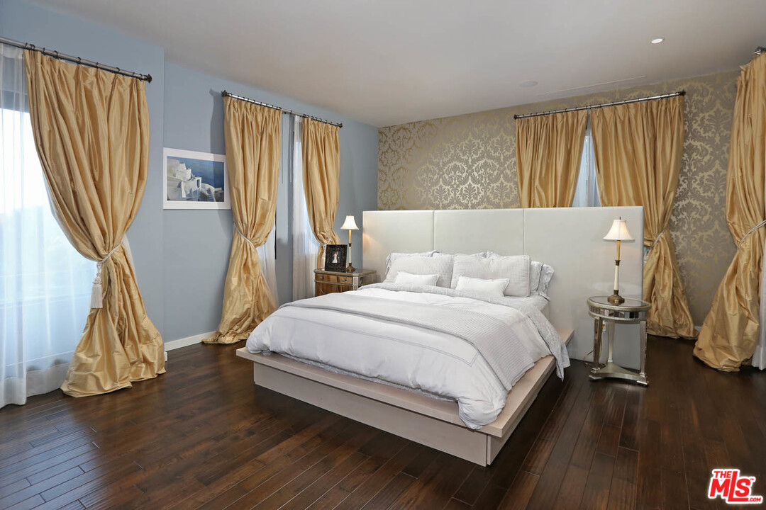 8532 Ridpath Drive Los Angeles, CA 90046 - Photo 21 of 52 a bedroom with a bed and a window