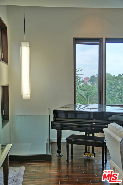8532 Ridpath Drive Los Angeles, CA 90046 - Photo 26 of 52 a sitting area with furniture and a window