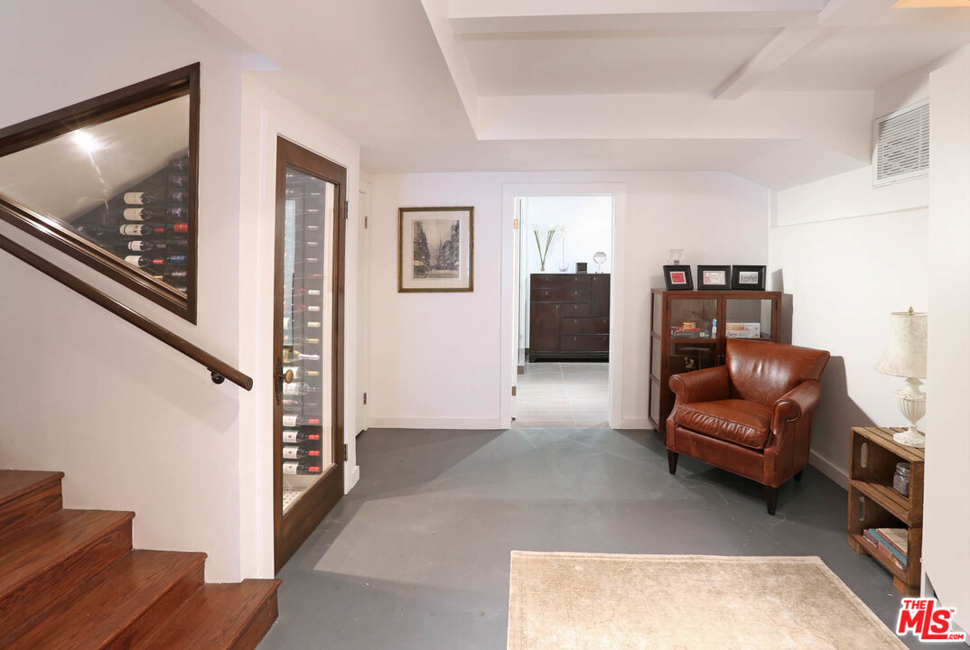 8532 Ridpath Drive Los Angeles, CA 90046 - Photo 33 of 52 a living room with furniture and a flat screen tv