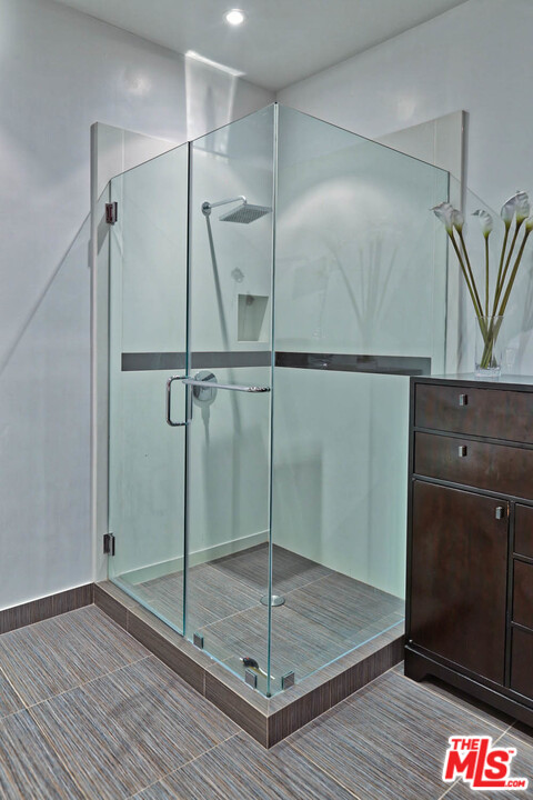 8532 Ridpath Drive Los Angeles, CA 90046 - Photo 37 of 52 a bathroom with a shower and a sink