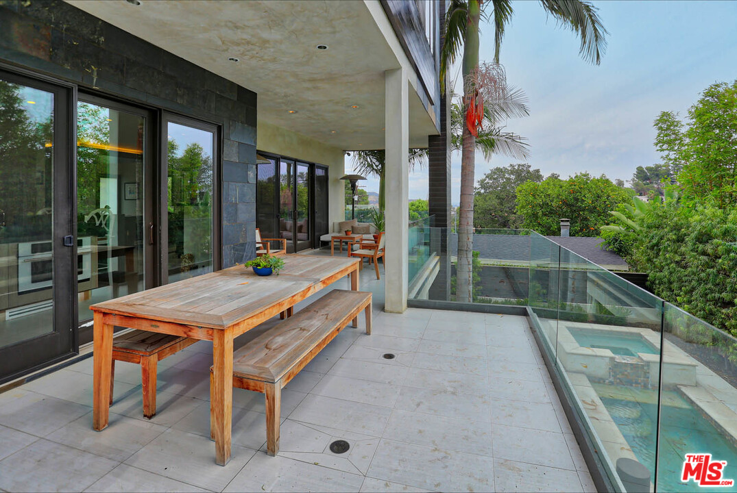 8532 Ridpath Drive Los Angeles, CA 90046 - Photo 44 of 52 a patio with table and chairs
