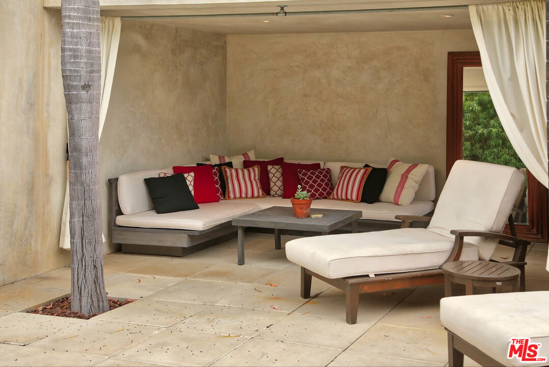 8532 Ridpath Drive Los Angeles, CA 90046 - Photo 48 of 52 a living room with furniture and a rug