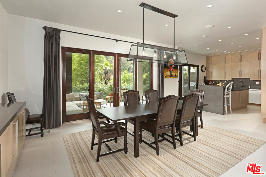 8532 Ridpath Drive Los Angeles, CA 90046 - Photo 6 of 52 a view of a dining room with furniture window and outside view