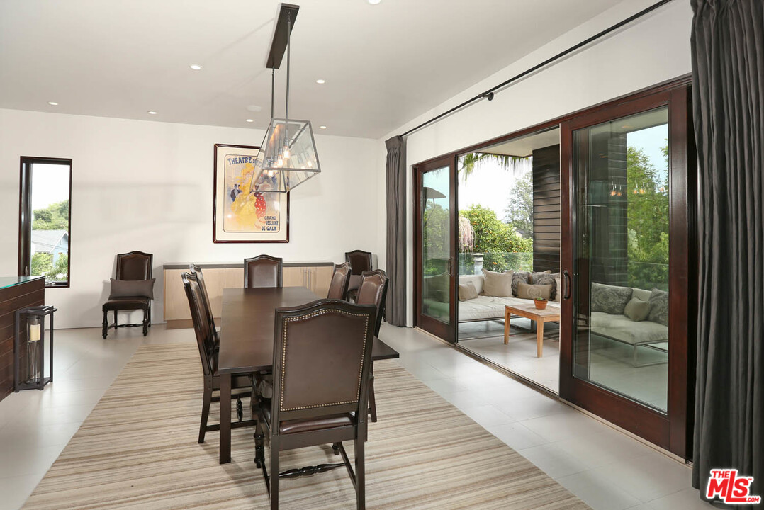 8532 Ridpath Drive Los Angeles, CA 90046 - Photo 7 of 52 a view of a dining room with furniture window and outside view