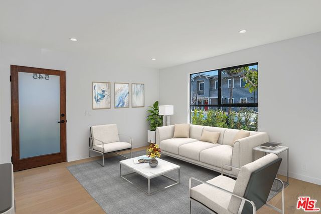 a living room with furniture and a window