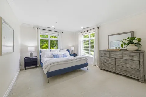a bed room with a bed and a dresser