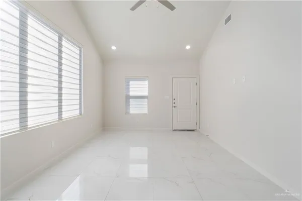 a view of an empty room with a window