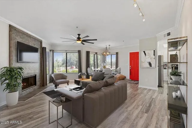 a living room with furniture and a large window