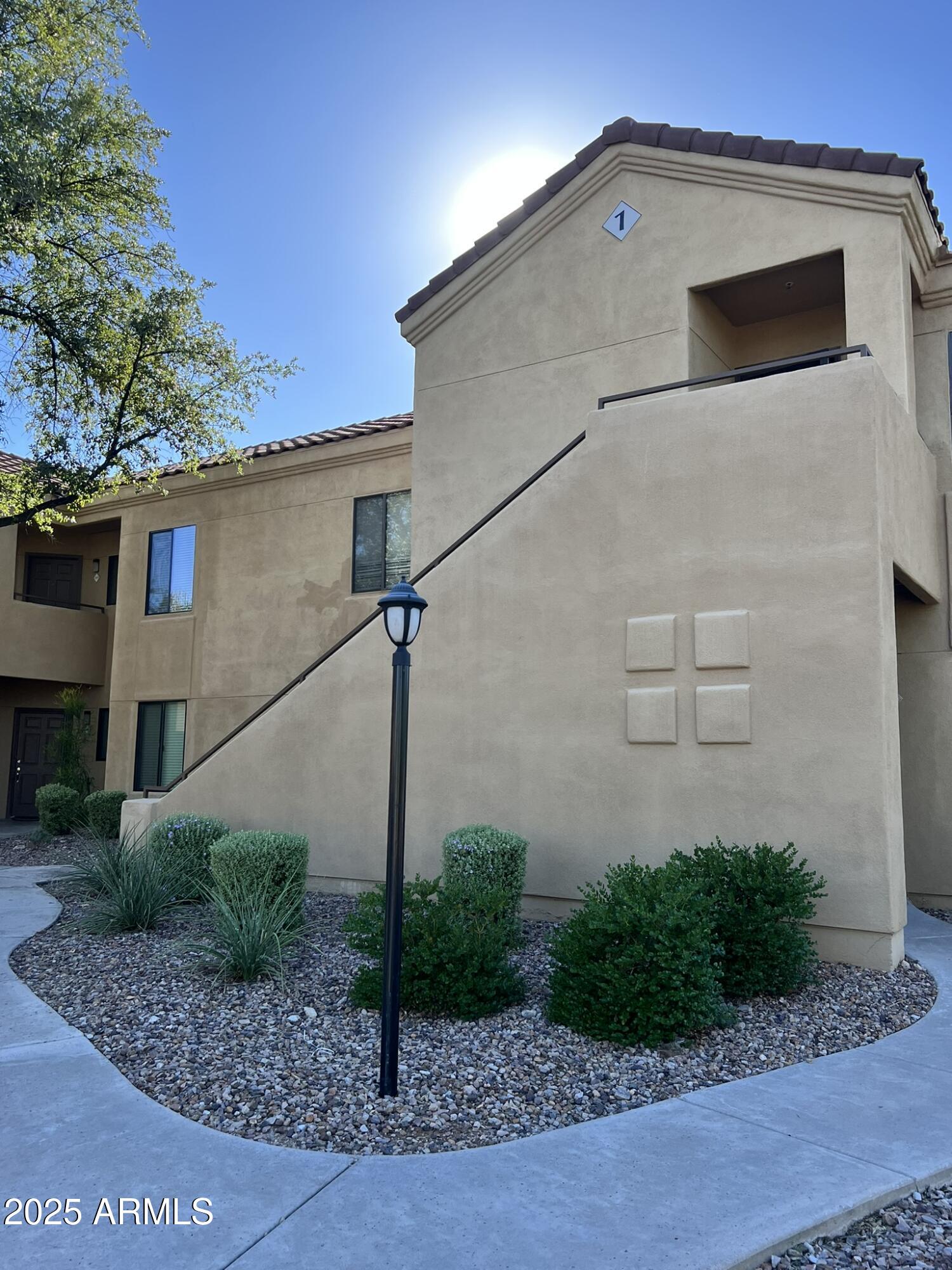 7575 East Indian Bend Road, Unit 2002 Scottsdale, AZ 85250 - Photo 12 of 24 a front view of a house with garage