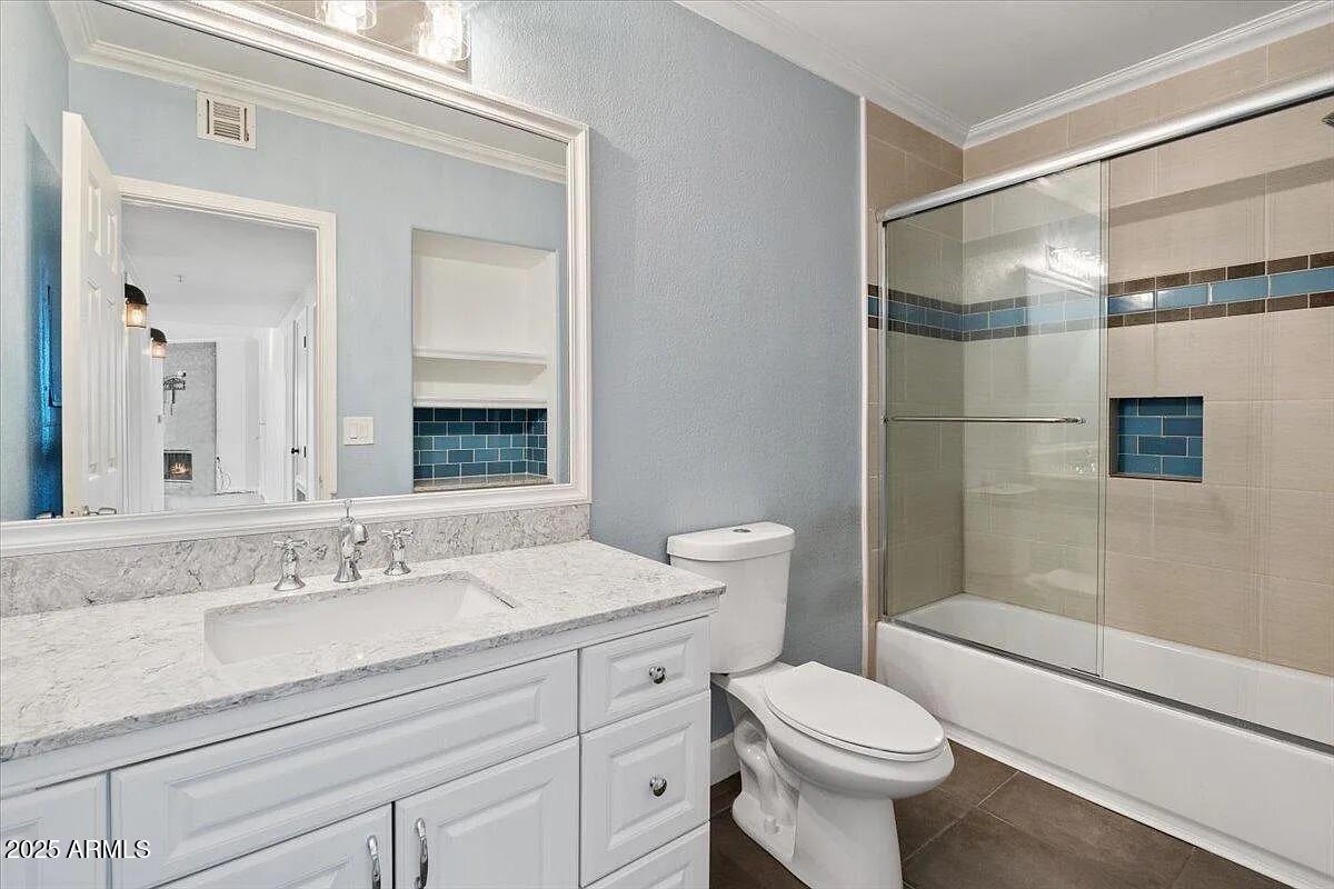 7575 East Indian Bend Road, Unit 2002 Scottsdale, AZ 85250 - Photo 8 of 24 a bathroom with a sink toilet and shower