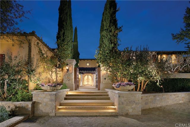 a view of a fountain in front of a house
