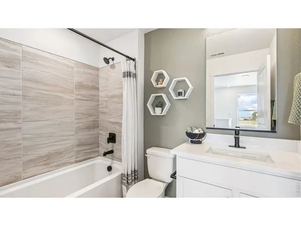 a bathroom with a sink toilet a shower and bathtub