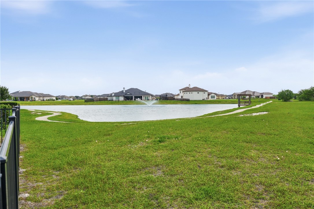 8710 KIng Ranch Drive Corpus Christi, TX 78414 - Photo 36 of 38 a view of a lake with houses in the background