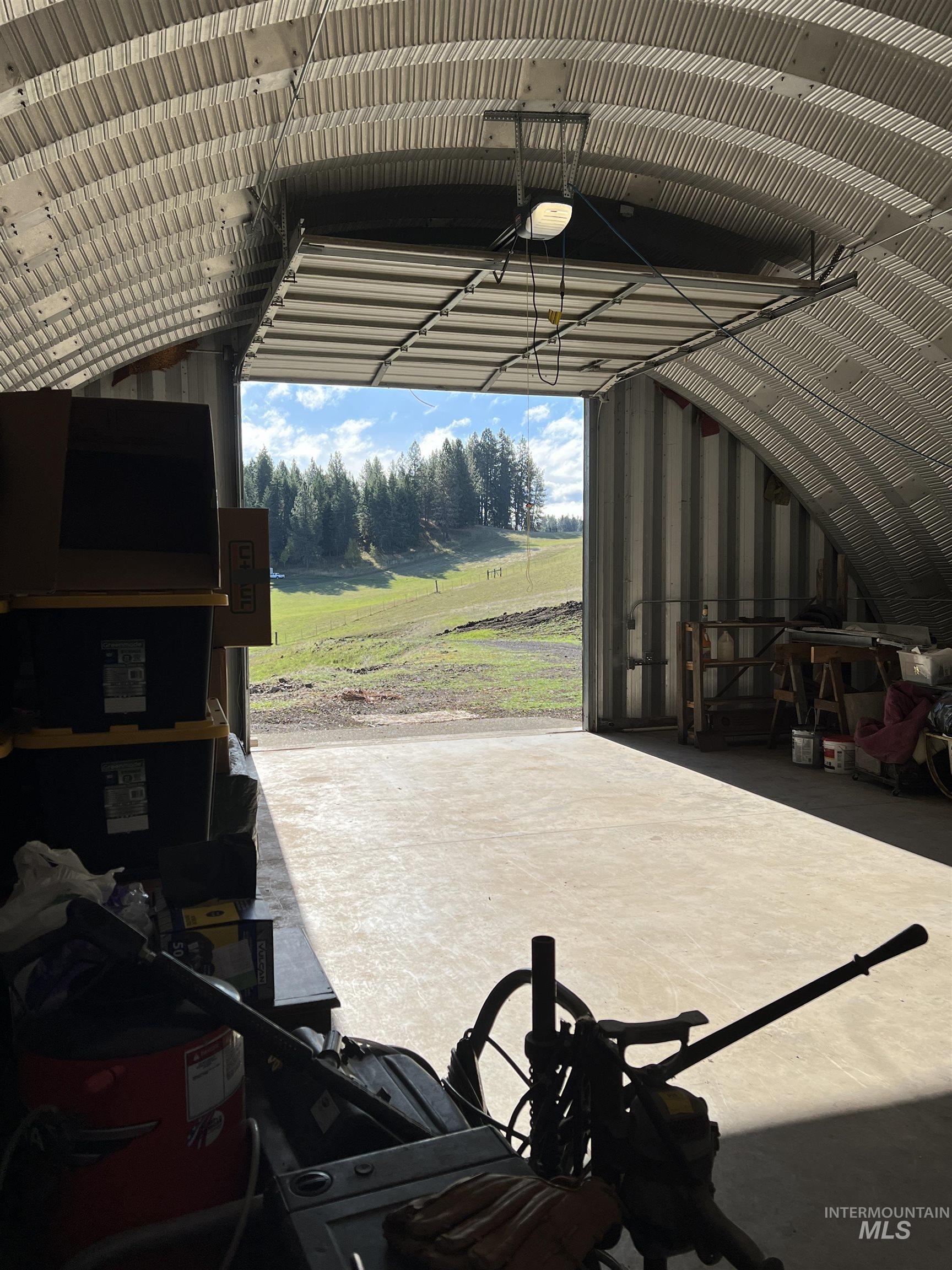 784 Leitch Creek Road Kooskia, ID 83539 - Photo 11 of 24 Garage featuring a garage door opener and metal wall