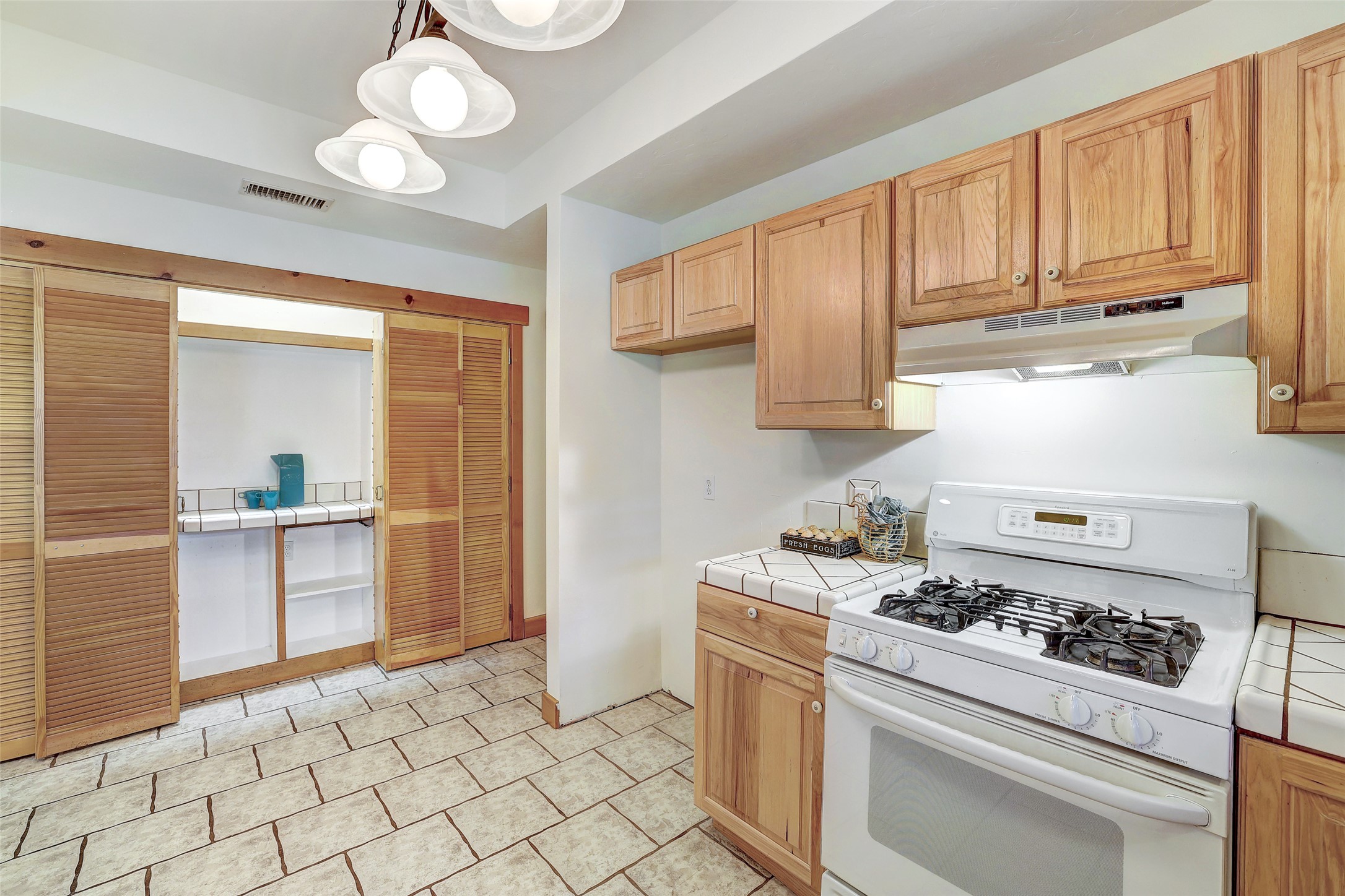 125 Kyle Lane Georgetown, TX 78633 - Photo 16 of 34 a kitchen with a stove a sink and cabinets