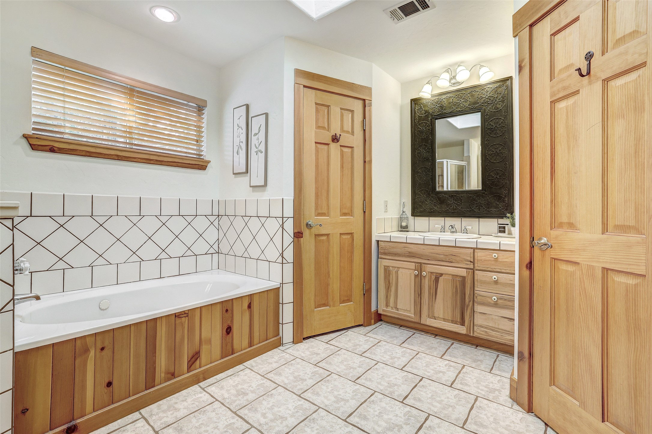 125 Kyle Lane Georgetown, TX 78633 - Photo 21 of 34 a bathroom with a tub sink and mirror