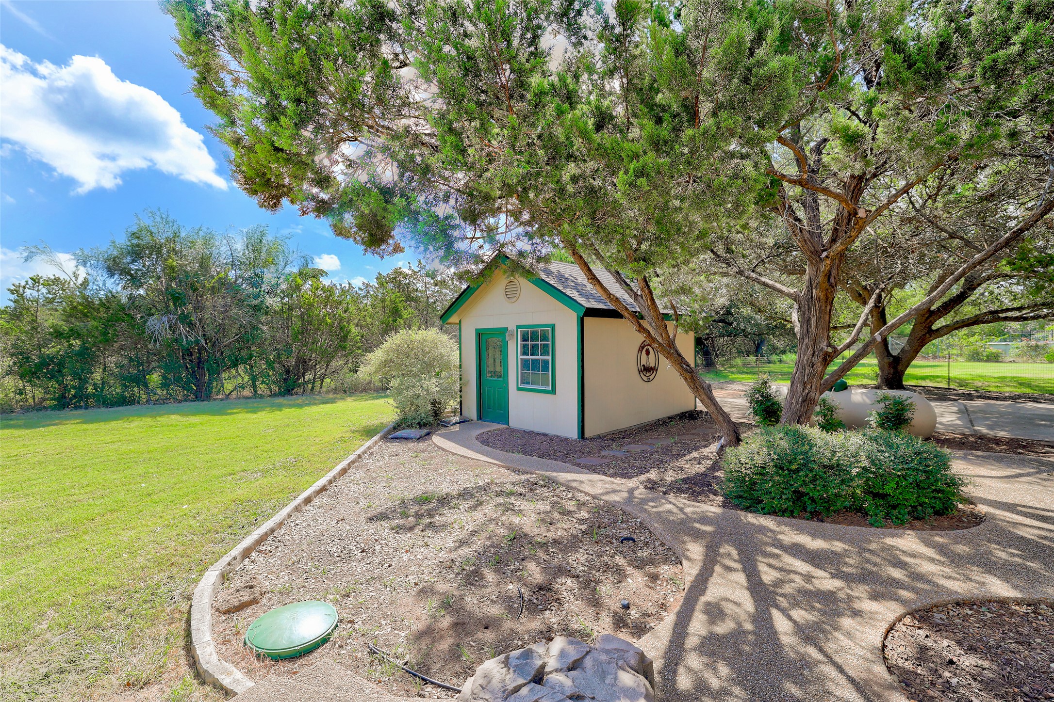125 Kyle Lane Georgetown, TX 78633 - Photo 32 of 34 a view of a house with a yard and large tree