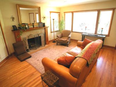 205 Butterfield Road San Anselmo, CA 94960 - Photo 2 of 6 a living room with furniture a large window and a fireplace