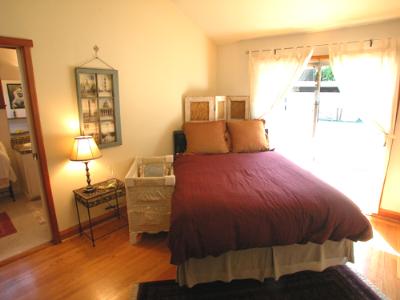 205 Butterfield Road San Anselmo, CA 94960 - Photo 6 of 6 a bedroom with a bed and a chair with the wooden floor