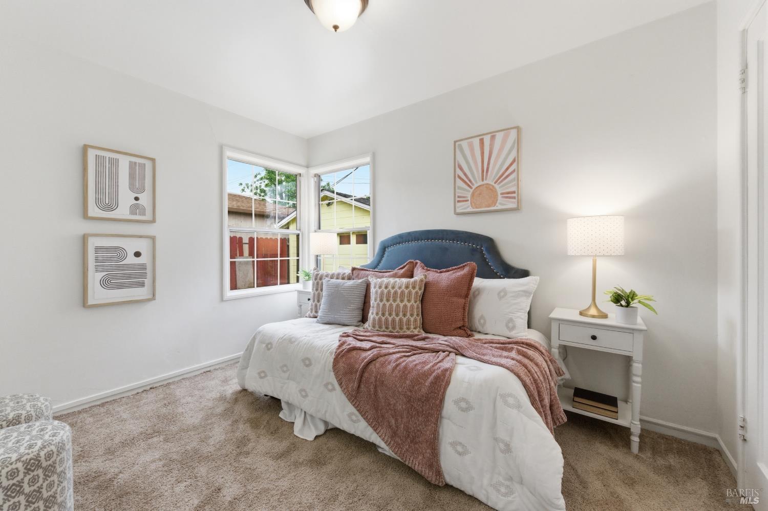 691 Annette Avenue Vallejo, CA 94591 - Photo 21 of 41 a bedroom with a bed and wooden floor