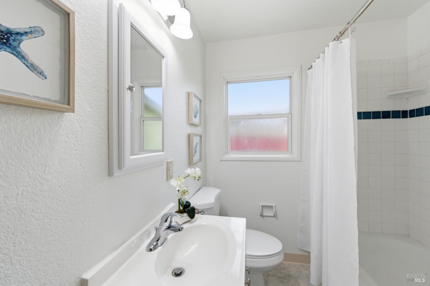 691 Annette Avenue Vallejo, CA 94591 - Photo 26 of 41 a bathroom with a sink a toilet and shower
