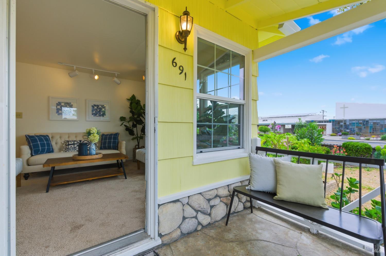 691 Annette Avenue Vallejo, CA 94591 - Photo 3 of 41 a view of a patio with a table and chairs and potted plants