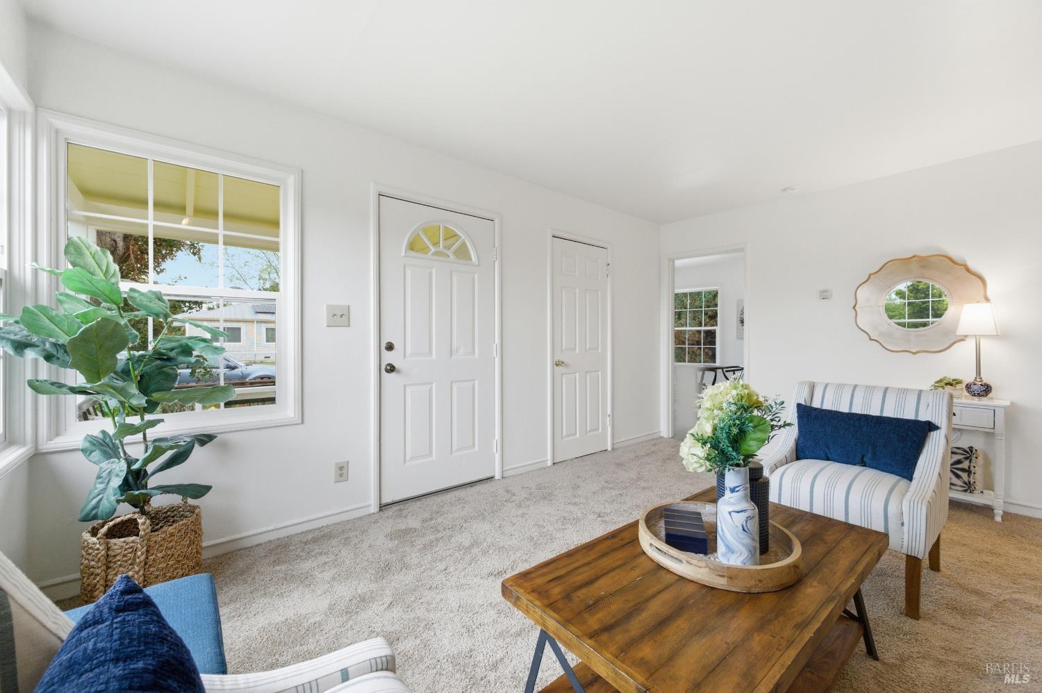 691 Annette Avenue Vallejo, CA 94591 - Photo 4 of 41 a living room with furniture potted plant and a window