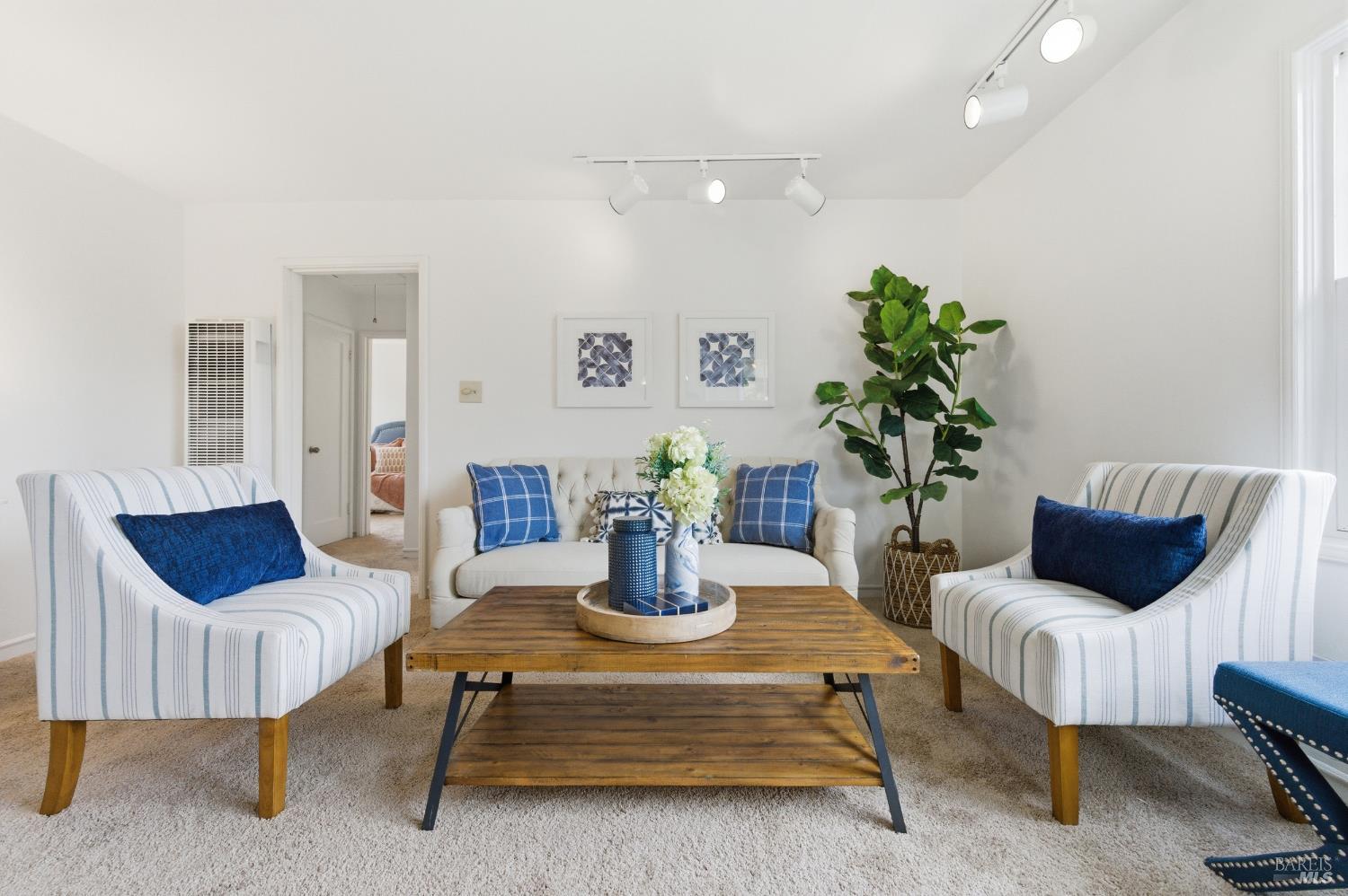 691 Annette Avenue Vallejo, CA 94591 - Photo 6 of 41 a living room with furniture and a potted plant