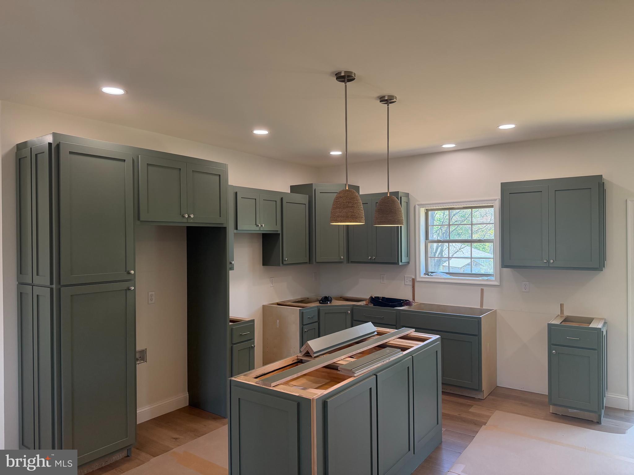 54 3rd Avenue Chambersburg, PA 17202 - Photo 4 of 8 a kitchen with stainless steel appliances granite countertop a refrigerator a sink a stove and a refrigerator