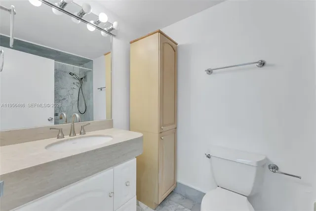 a bathroom with a bath tub with a shower