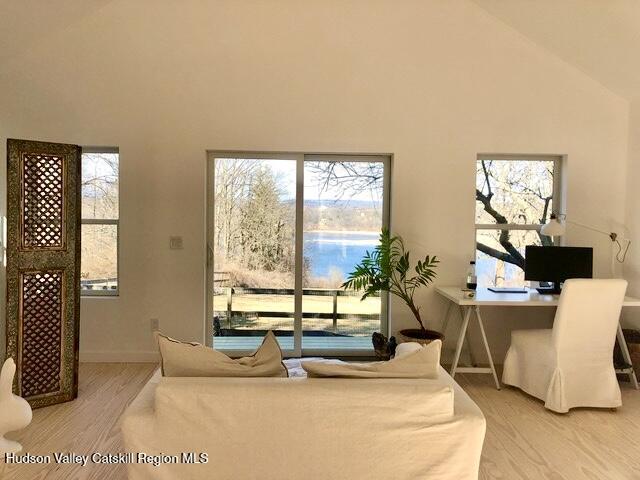 188 Mt Merino Road Hudson, NY 12534 - Photo 17 of 23 a bed sitting in a bedroom next to a window