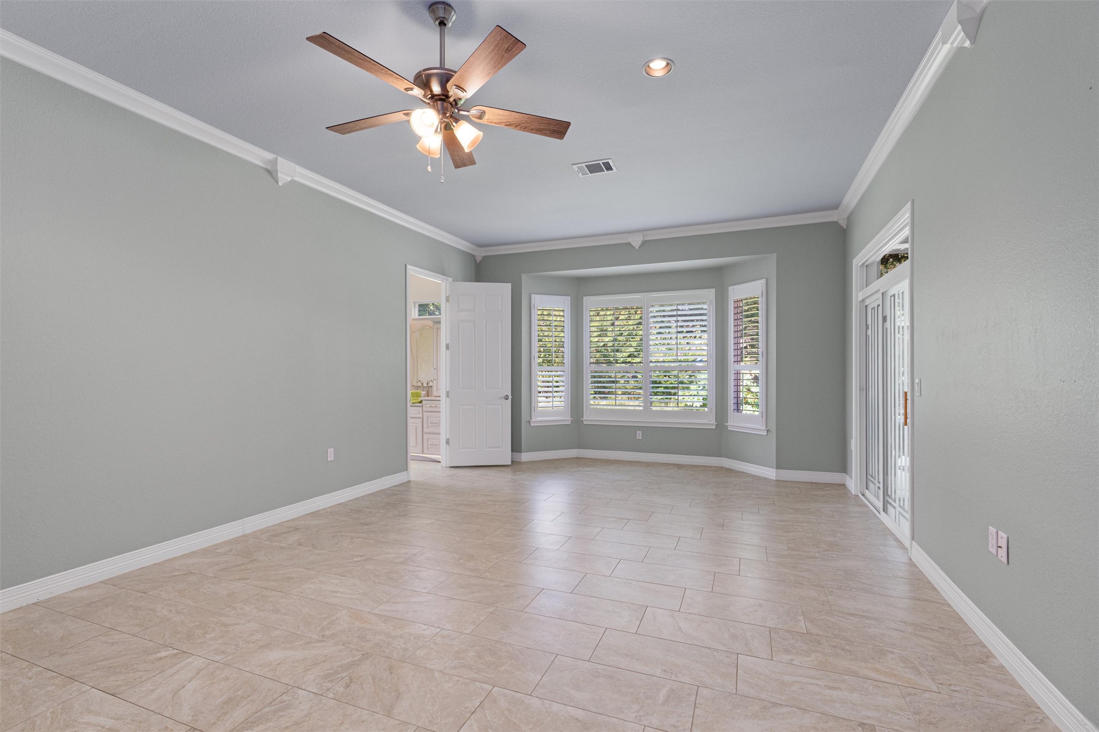 282 Trail Of The Flowers Georgetown, TX 78633 - Photo 16 of 38 wooden floor in an empty room with a window