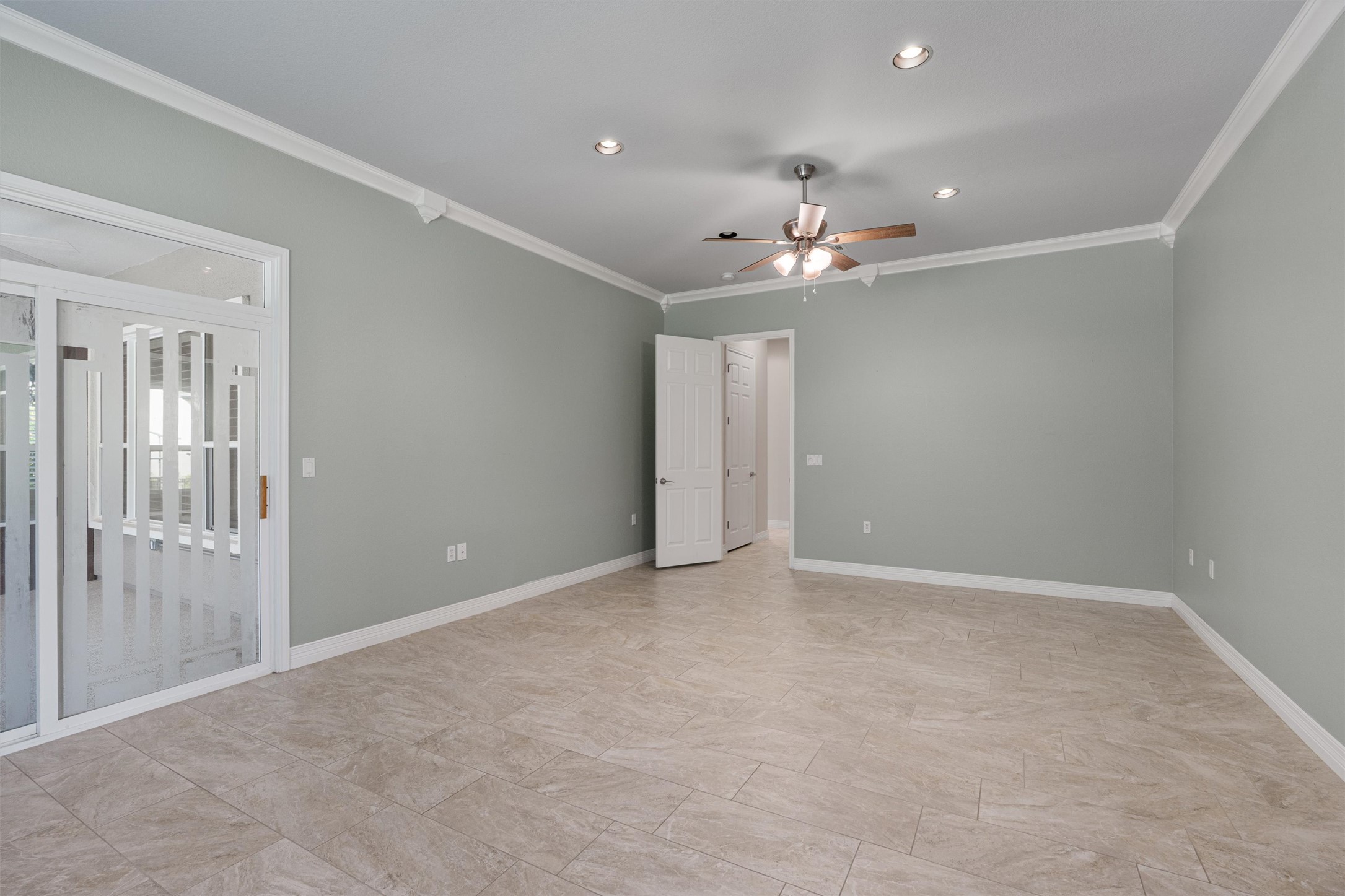 282 Trail Of The Flowers Georgetown, TX 78633 - Photo 17 of 38 a view of an empty room with a ceiling fan