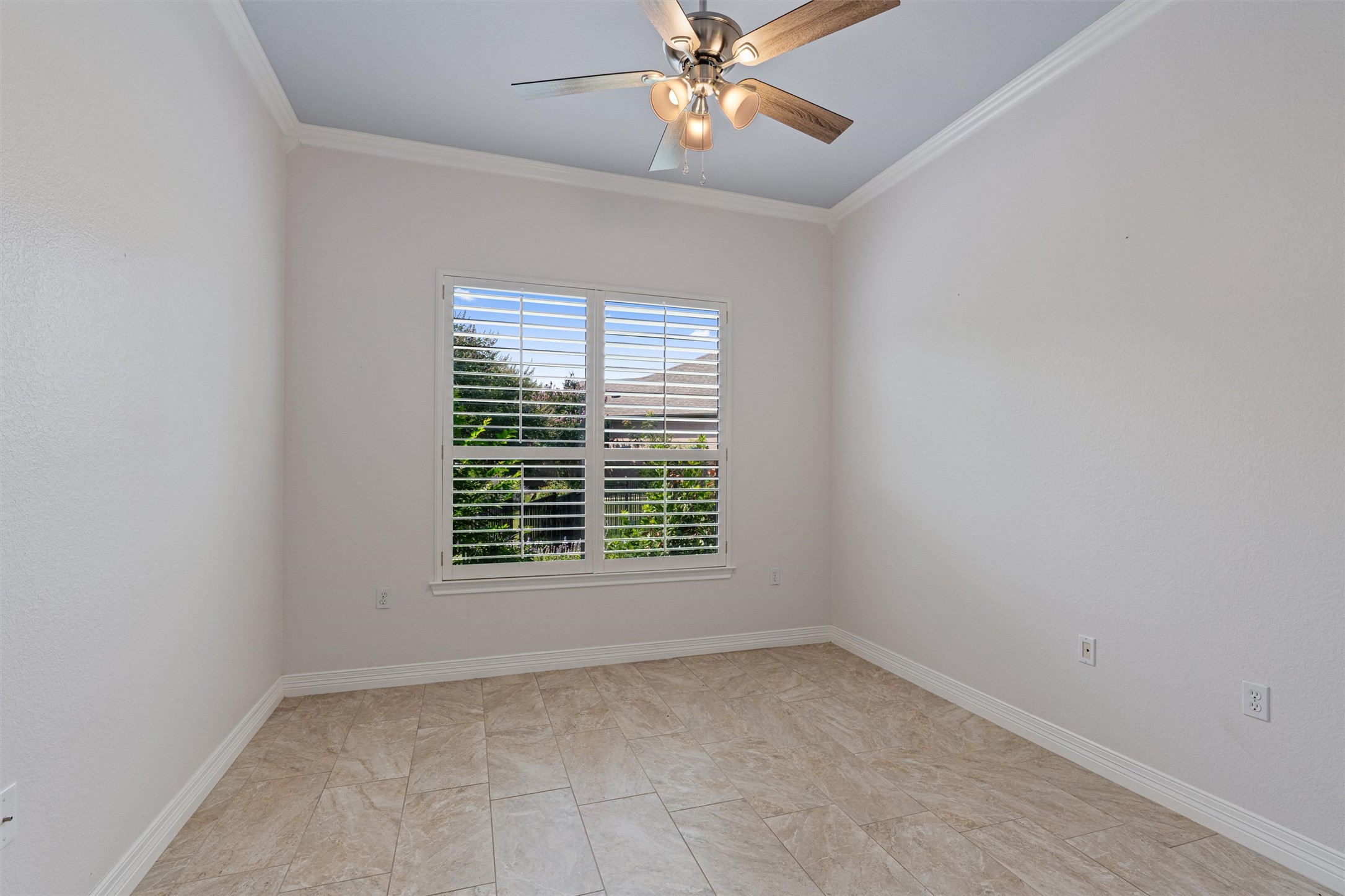 282 Trail Of The Flowers Georgetown, TX 78633 - Photo 23 of 38 an empty room with a window and a fan