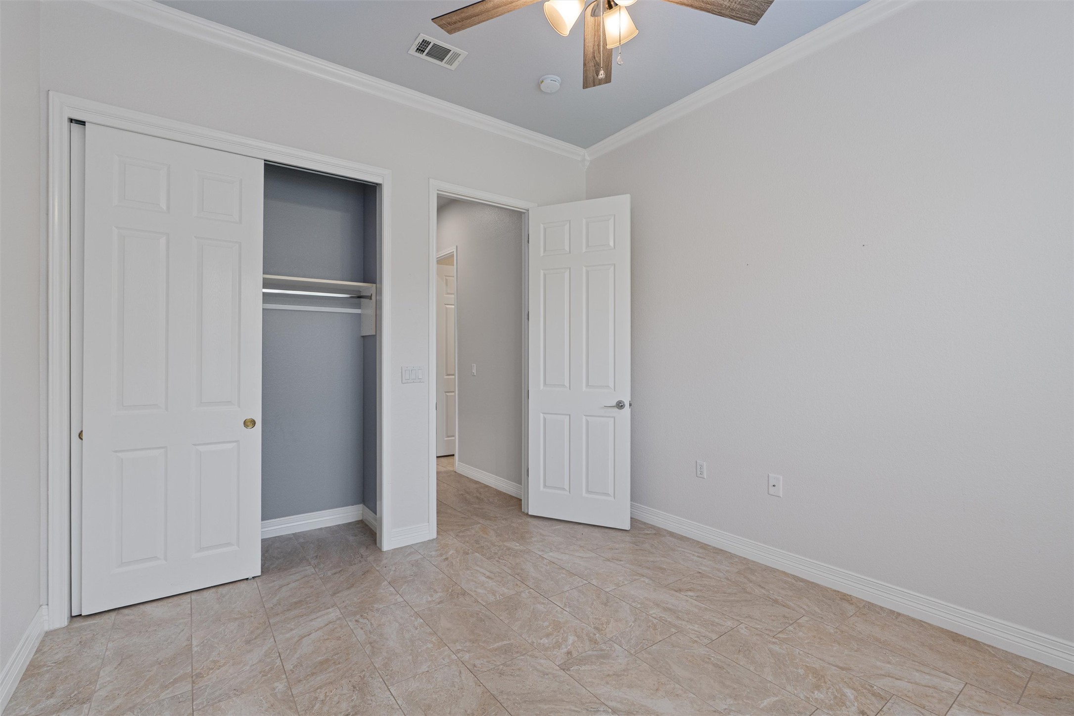 282 Trail Of The Flowers Georgetown, TX 78633 - Photo 24 of 38 an empty room with chandelier fan and windows