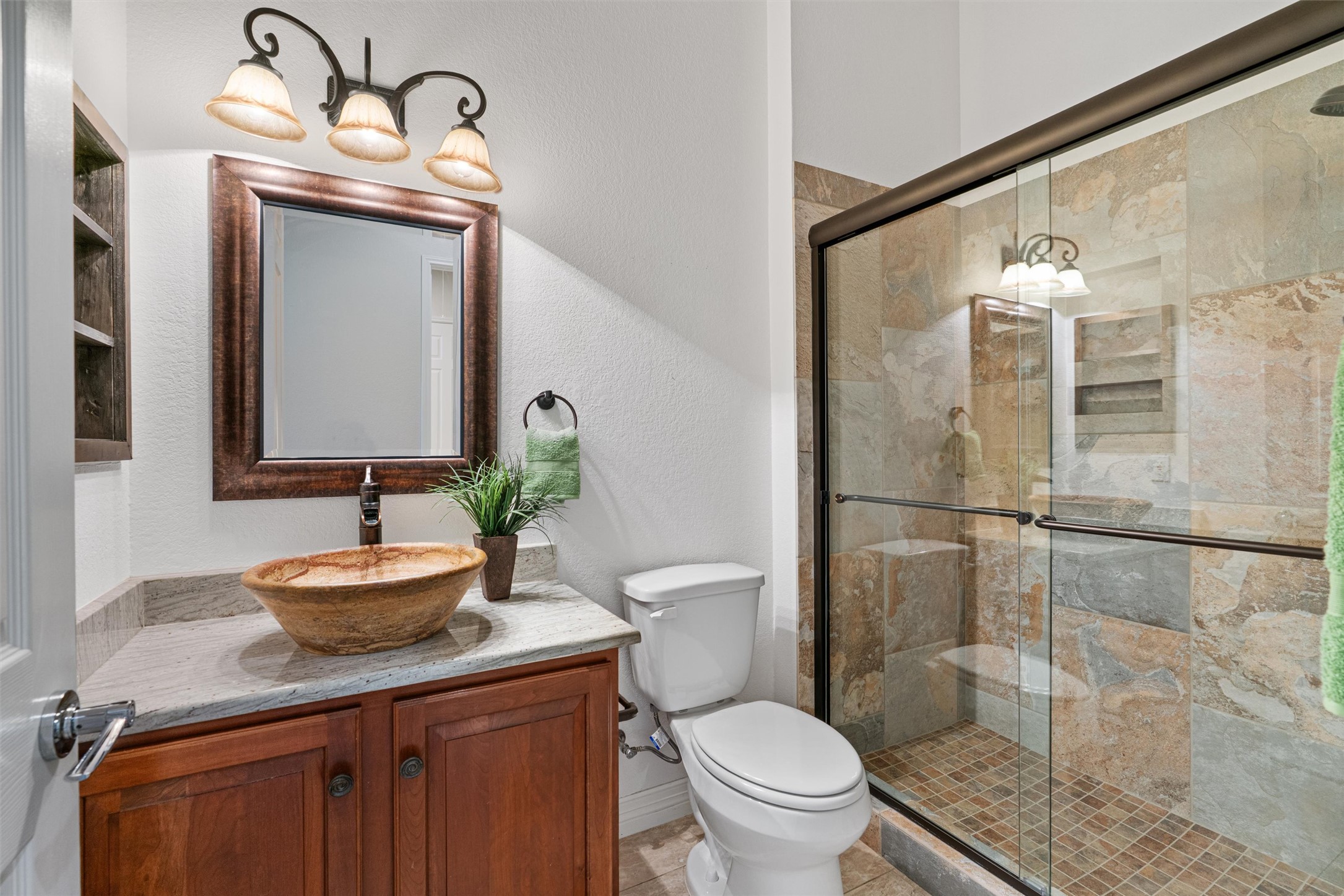 282 Trail Of The Flowers Georgetown, TX 78633 - Photo 25 of 38 a bathroom with a sink a toilet and shower