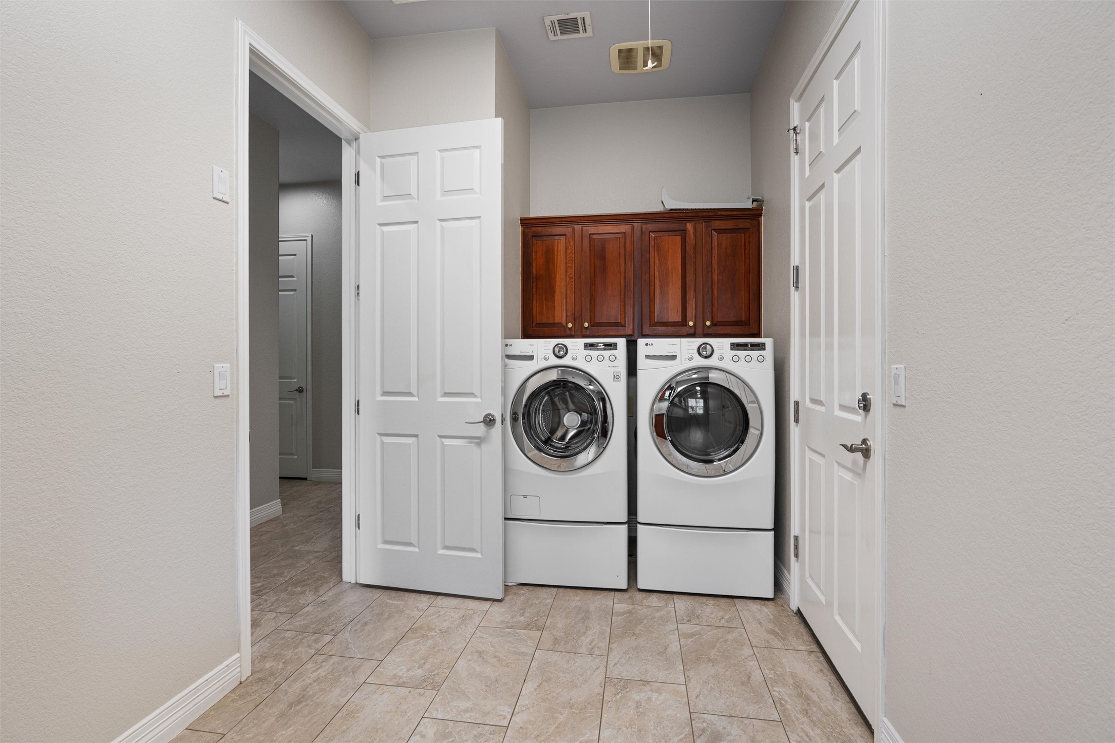 282 Trail Of The Flowers Georgetown, TX 78633 - Photo 26 of 38 a utility room with dryer and washer