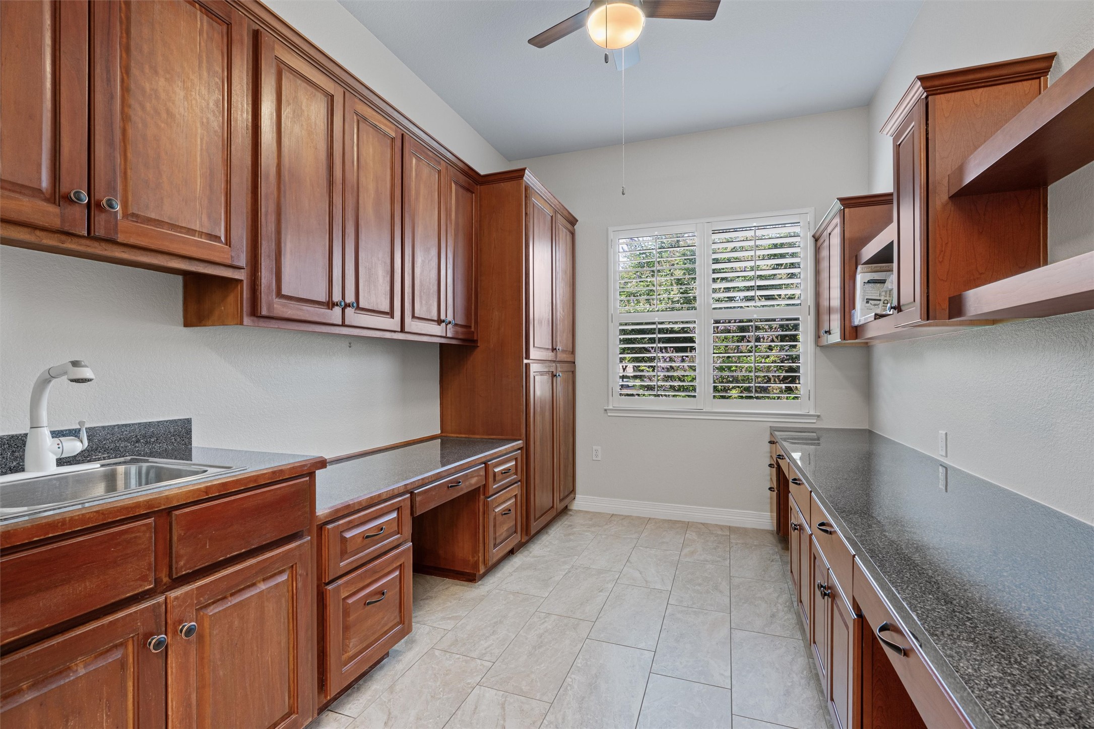 282 Trail Of The Flowers Georgetown, TX 78633 - Photo 27 of 38 a kitchen with stainless steel appliances granite countertop a sink stove and cabinets