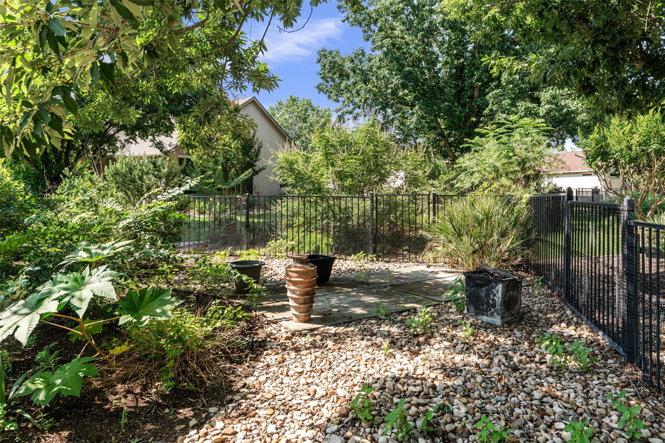 282 Trail Of The Flowers Georgetown, TX 78633 - Photo 36 of 38 a view of a fire pit with large trees
