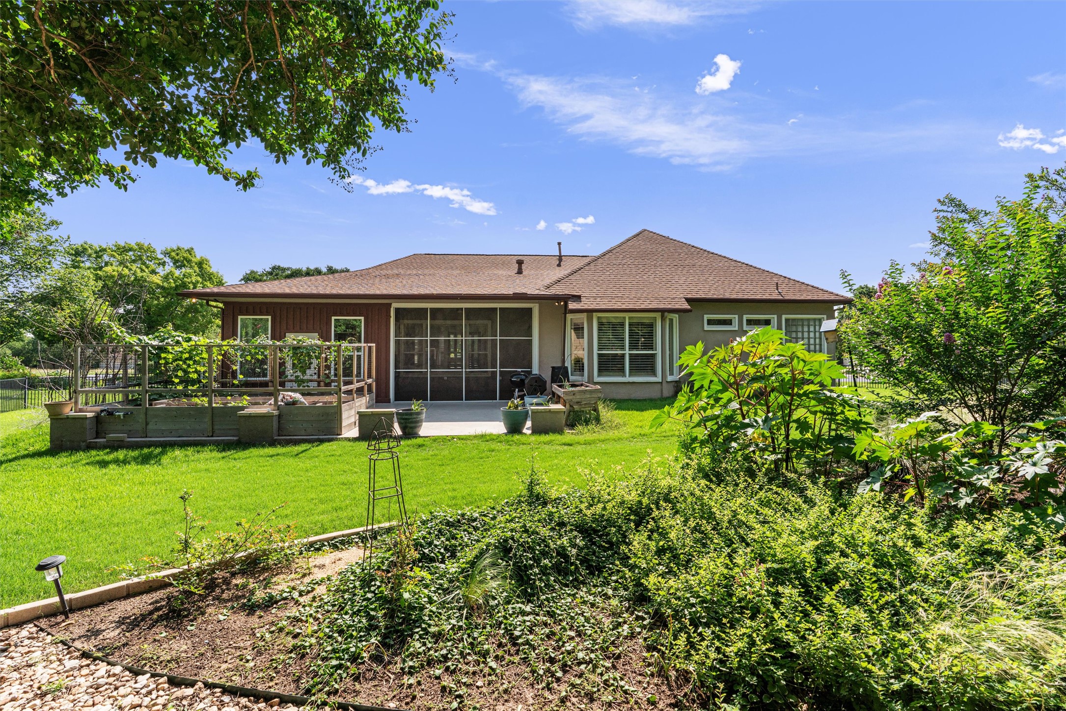 282 Trail Of The Flowers Georgetown, TX 78633 - Photo 37 of 38 a front view of a house with a garden