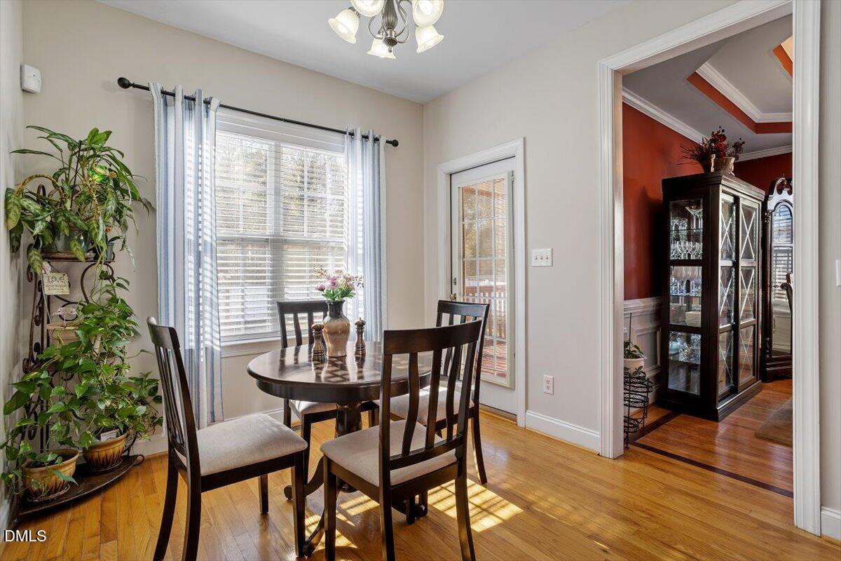 541 Spruce Meadows Lane Willow Spring, NC 27592 - Photo 13 of 40 a view of a dining room with furniture and window