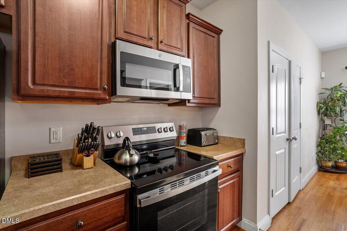 541 Spruce Meadows Lane Willow Spring, NC 27592 - Photo 20 of 40 a kitchen with a stove and a microwave
