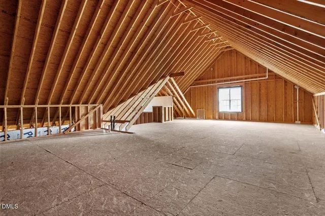 a view of an empty room with stairs