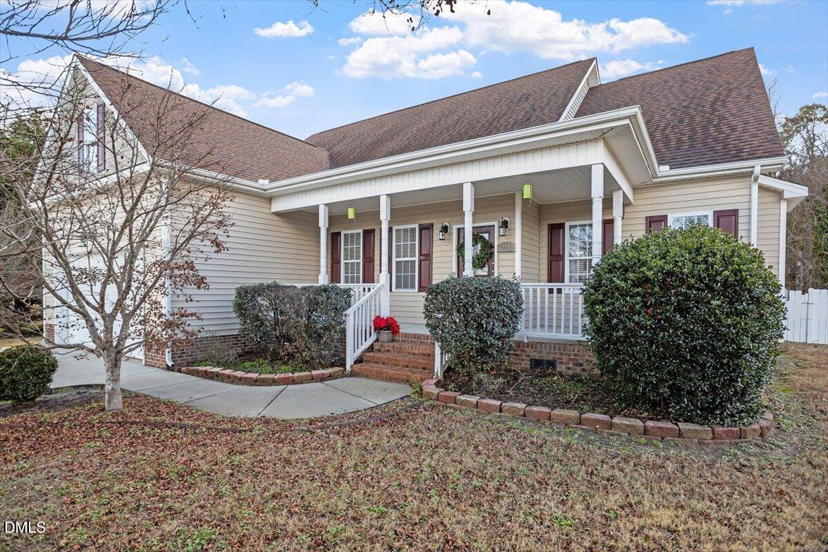 541 Spruce Meadows Lane Willow Spring, NC 27592 - Photo 3 of 40 a view of a house with a yard and sitting space