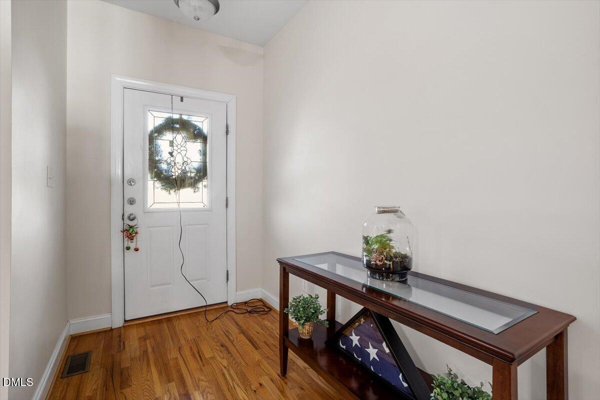541 Spruce Meadows Lane Willow Spring, NC 27592 - Photo 7 of 40 a view of empty room with wooden floor