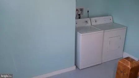 a utility room with a sink washer and dryer
