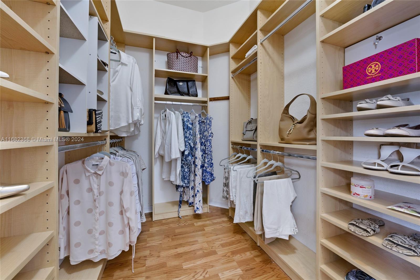 6850 Southwest 159th Place Miami, FL 33193 - Photo 11 of 18 a view of walk in closet with clothes and shoes